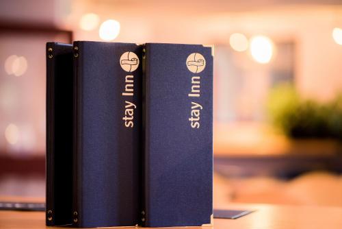two books sitting on top of a table at Stay Inn Manchester in Manchester