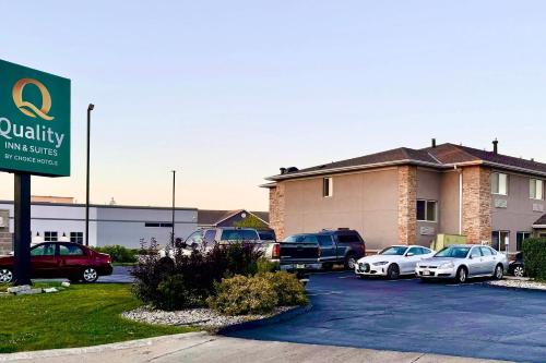 a parking lot with cars parked in front of a building at Quality Inn & Suites Green Bay - Ashwaubenon in Green Bay