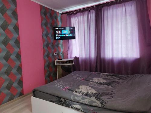 Ένα ή περισσότερα κρεβάτια σε δωμάτιο στο Райский уголок