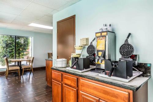 a kitchen with a counter with a coffee maker at Quality Suites Paducah I-24 in Paducah