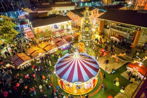 an aerial view of a christmas market with a christmas tree at Thissio Hideaway Suite in Athens