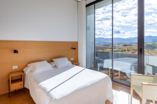 Postel nebo postele na pokoji v ubytování Hotel-Bodega Finca de Los Arandinos