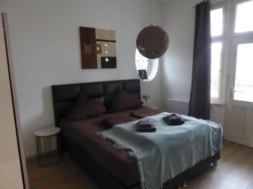 En eller flere senge i et værelse på Villa Augusta