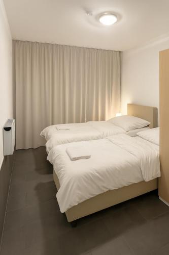 Postel nebo postele na pokoji v ubytování Work & Travel Lodge Münsingen
