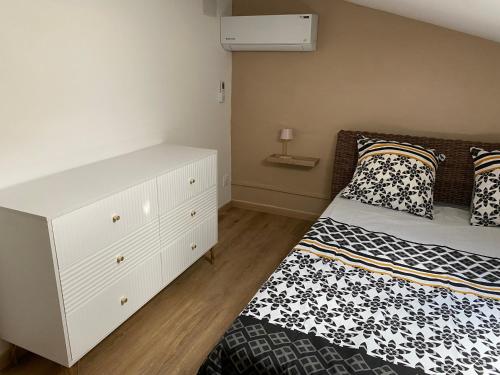 Ένα ή περισσότερα κρεβάτια σε δωμάτιο στο Appartement dans le quartier de terre sainte elona