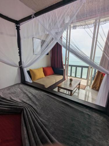 a living room with a couch in a tent at Villa Sea View in Galle