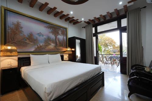 Postel nebo postele na pokoji v ubytování Nana Villa Hue