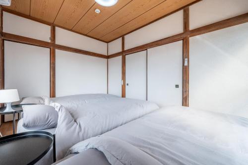 Ένα ή περισσότερα κρεβάτια σε δωμάτιο στο StayMaster House