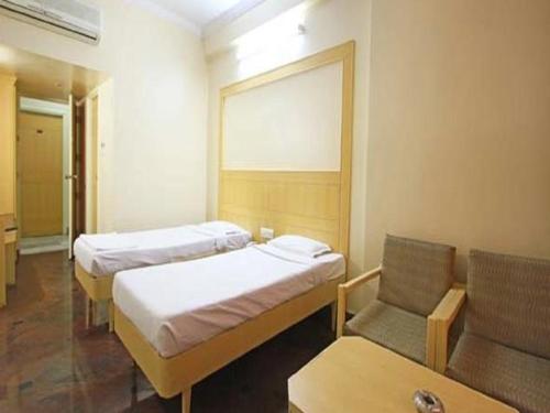 Ένα ή περισσότερα κρεβάτια σε δωμάτιο στο Raj classic inn