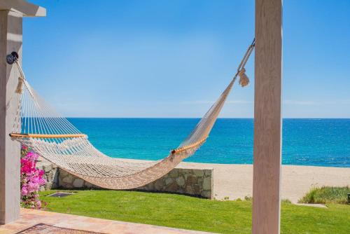 a hammock on the beach near the ocean at Casa Piedra Blanca in San José del Cabo