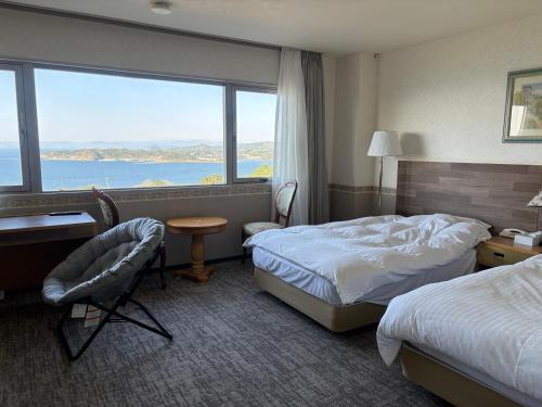 Postel nebo postele na pokoji v ubytování 天海の城