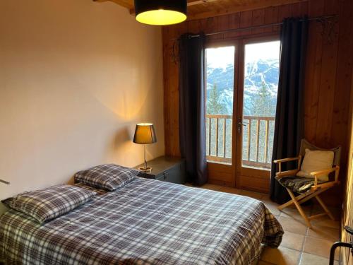En eller flere senge i et værelse på Chalet d exception ensoleillé, vue grandiose
