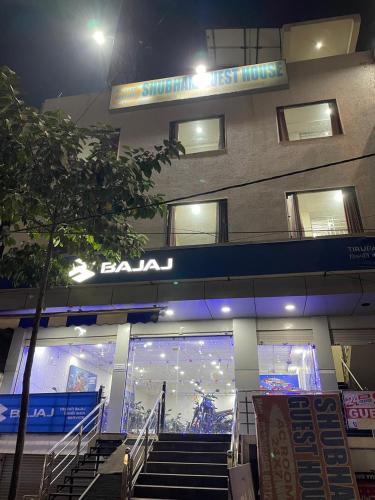 a building with stairs in front of it at night at Shubham guest house in Gwalior