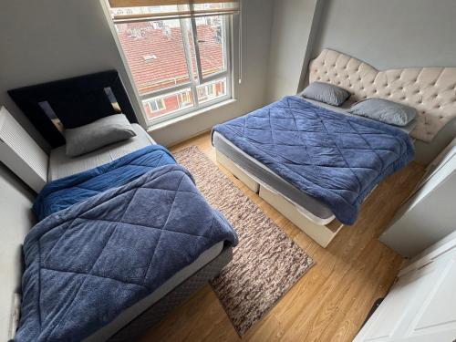 Ένα ή περισσότερα κρεβάτια σε δωμάτιο στο Centralsuit