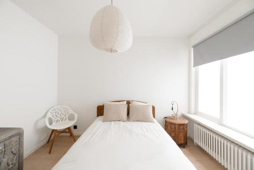 Ένα ή περισσότερα κρεβάτια σε δωμάτιο στο d'Oville d'Ostende