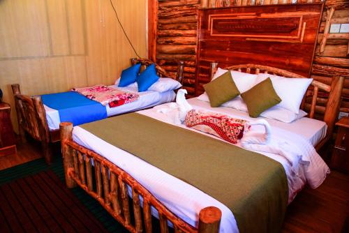 Mountain Face inn tesisinde bir odada yatak veya yataklar