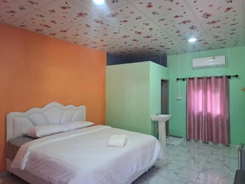 Ένα ή περισσότερα κρεβάτια σε δωμάτιο στο ฟาดิลบังกะโล fadel bangalow