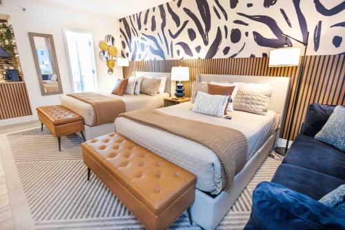 a bedroom with two beds and a couch at Beautiful Zen Nest 1mile New EPIC Universe in Orlando