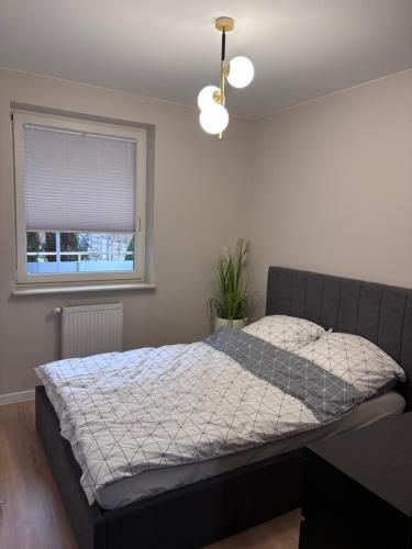 Ένα ή περισσότερα κρεβάτια σε δωμάτιο στο Apartament Nowowiejska, osiedle zamknięte, 24h szybkie zameldowanie!