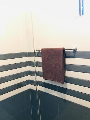 a towel hanging on a towel rack in a bathroom at Dream Villa in Batigama