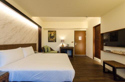 Postel nebo postele na pokoji v ubytování 嬉安平 Si Anping by Hotel Si