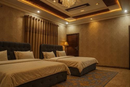 Postel nebo postele na pokoji v ubytování The Guest House Islamabad