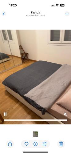 a bed sitting on the floor in a room at b&b da maty in Faenza