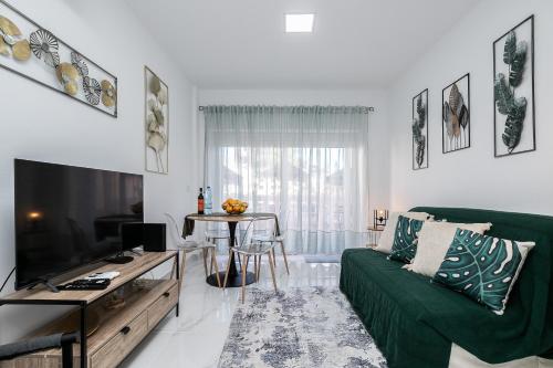 Μια τηλεόραση ή/και κέντρο ψυχαγωγίας στο Parque dos Reis Apartment 4 A