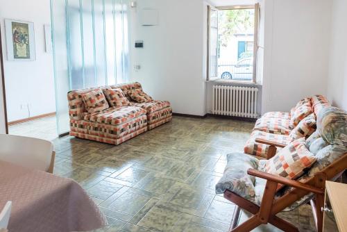 a living room with two couches and a window at A28 - Poggio, trilocale vista mare in Ancona