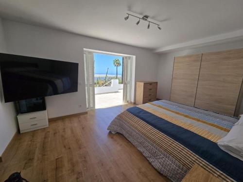 En eller flere senge i et værelse på Villa Las Norias