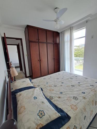 Ένα ή περισσότερα κρεβάτια σε δωμάτιο στο Cobertura Praia do Forte