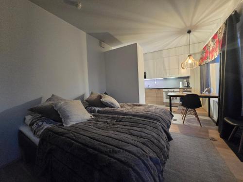 En eller flere senge i et værelse på Arctic City Base apartment