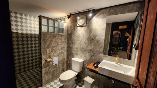 a bathroom with a sink and a toilet at Seven 50s in Pai