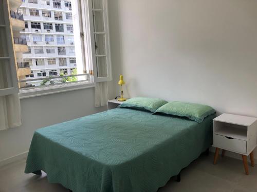 Postel nebo postele na pokoji v ubytování No melhor ponto do Flamengo, conforto e segurança no Rio