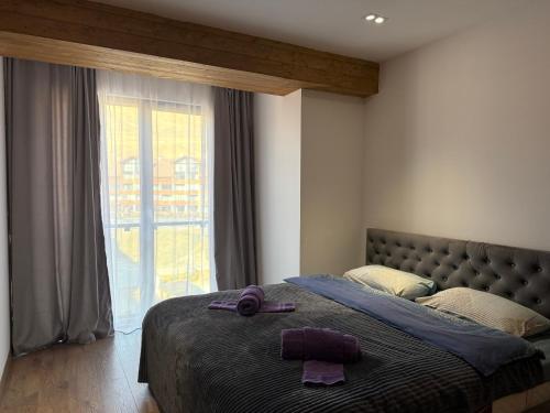 Giường trong phòng chung tại Gudauri Mountain View Studio