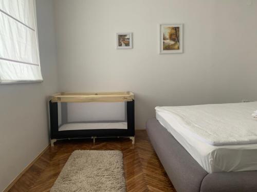 a small bedroom with a bed and a mirror at Lea in Križevci