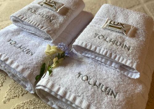 two white towels sitting on top of a table at TOLHUIN COLON in Colón
