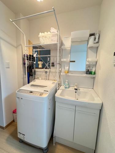 Ένα μπάνιο στο 羽憩館 Hakeikan KIX