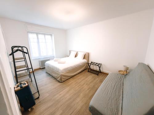 En eller flere senge i et værelse på Appartement Hyper Centre Moderne - French Luxury