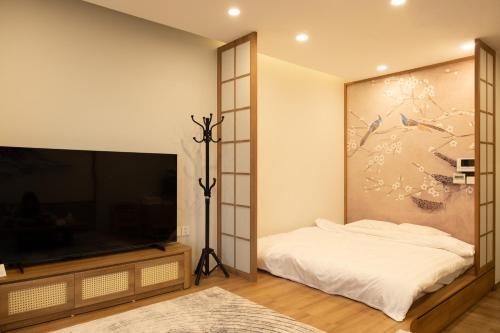 TV o dispositivi per l'intrattenimento presso Sakura Room Ở Space Ecopark
