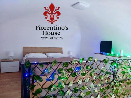 Ένα ή περισσότερα κρεβάτια σε δωμάτιο στο Fiorentino's House