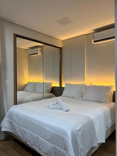 Ένα ή περισσότερα κρεβάτια σε δωμάτιο στο Flat Studio Cuiabá NOVO, apartamento1308, Ótima localização