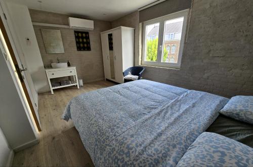 Ένα ή περισσότερα κρεβάτια σε δωμάτιο στο vakantiehuis 't Loreem