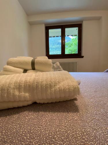 Postel nebo postele na pokoji v ubytování Bianchina - Bilocale con giardino privato