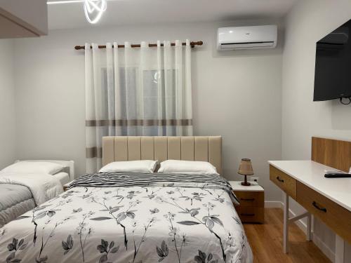 Ένα ή περισσότερα κρεβάτια σε δωμάτιο στο Guest House White Villa