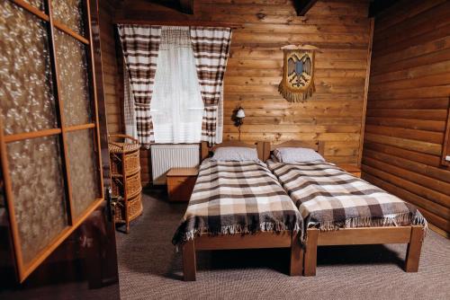 Postel nebo postele na pokoji v ubytování Готель Пацьорка