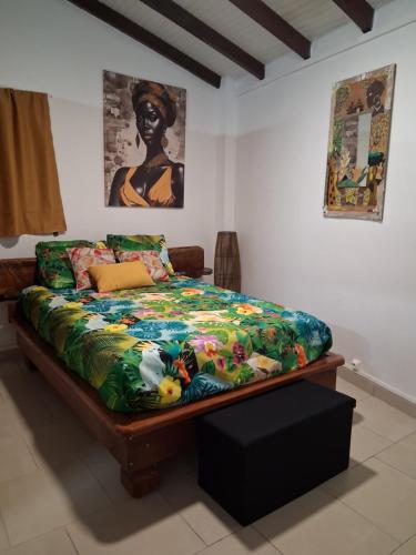 Postel nebo postele na pokoji v ubytování Maisonnette Ti Édèn