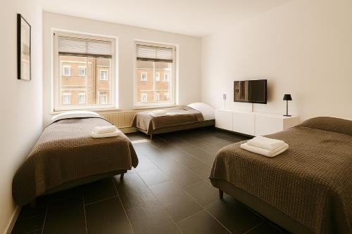 Кровать или кровати в номере Old Town Apartments