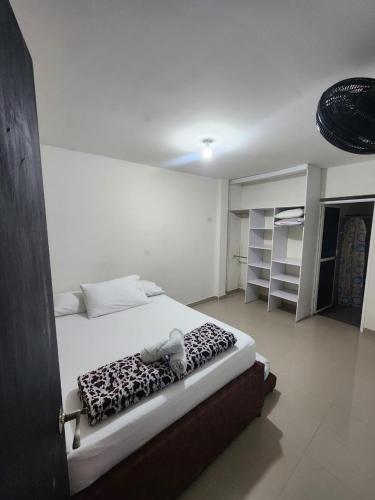 Postel nebo postele na pokoji v ubytování Hostal SHELTER LA PERLA - San luis, Antioquia, Colombia