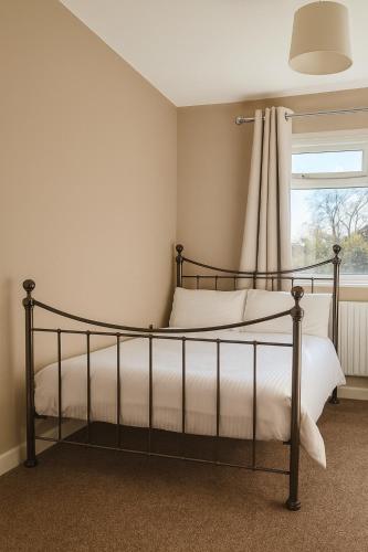 a bedroom with a bed and a window at City Stays Norwich NR3 in NWI